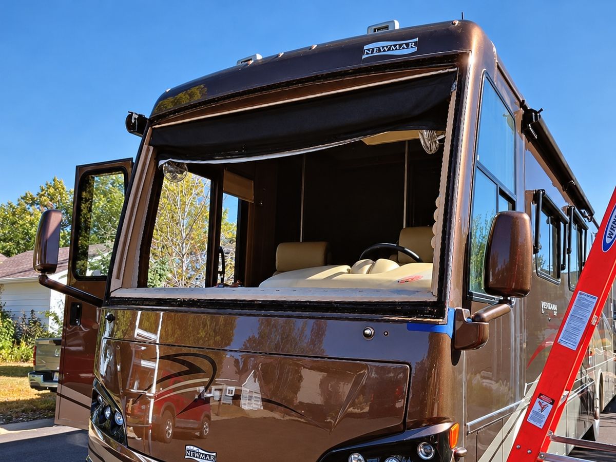 Newmar Ventana Class A motorhome with its windshield removed on a residential street